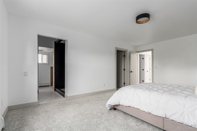 carpeted bedroom with a baseboard heating unit