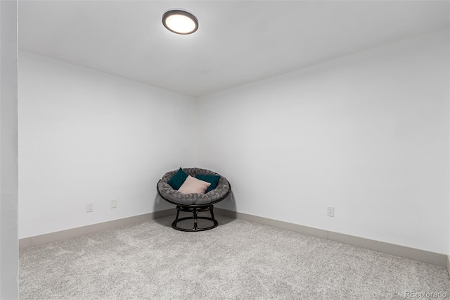 unfurnished room featuring light carpet