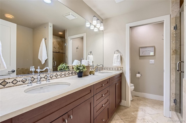 2700 E Louisiana Ave Unit 203, Denver, CO 80210 - full bath featuring double vanity, a shower stall, toilet, tile patterned floors, and baseboards
