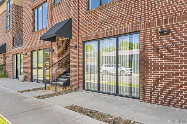 2700 E Louisiana Ave Unit 203, Denver, CO 80210 - doorway to property with brick siding