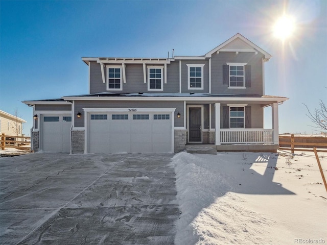 view of front of house featuring a porch and a garage