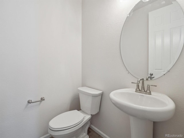 bathroom with toilet and sink