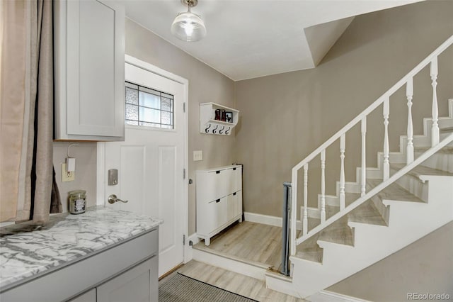 entryway with light hardwood / wood-style floors