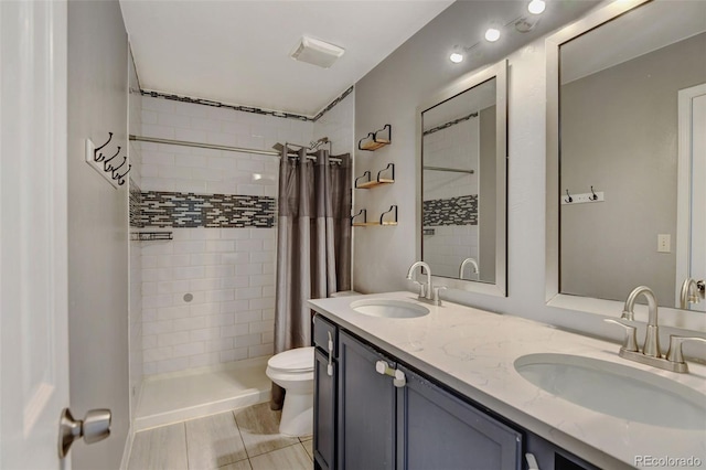 bathroom featuring toilet, vanity, and a shower with shower curtain