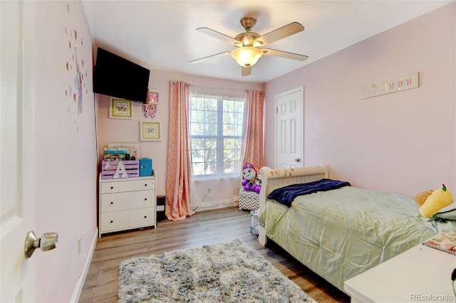 bedroom featuring hardwood / wood-style flooring and ceiling fan