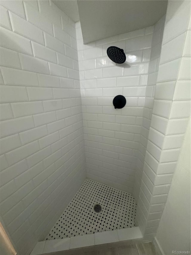 bathroom with a tile shower