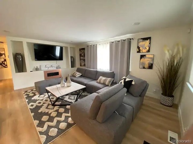 living room with light hardwood / wood-style floors