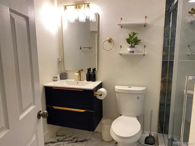 bathroom with vanity, toilet, and a shower