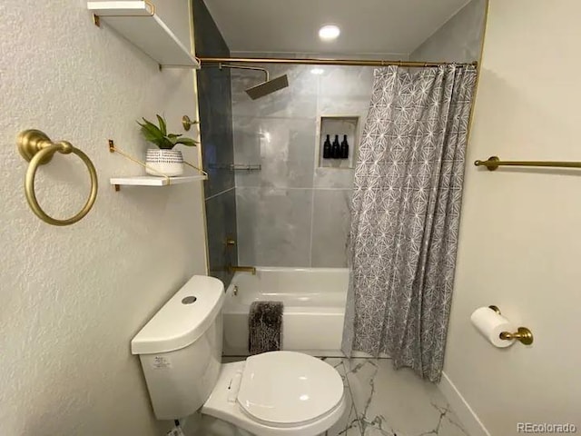 bathroom featuring shower / bath combination with curtain and toilet