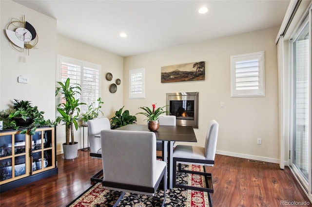 dining space featuring dark hardwood / wood-style floors