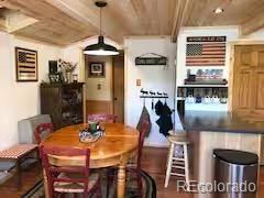 81 Gcr 461, Grand Lake, CO 80447 - dining room with a wood ceiling with exposed beams and wood finished floors
