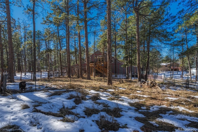 view of yard covered in snow