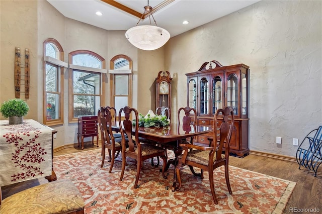 dining room featuring wood-type flooring and crown molding