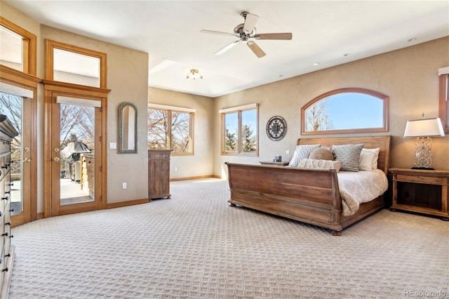 carpeted bedroom with ceiling fan and access to exterior