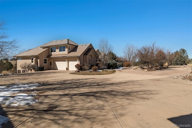 view of front of home with a garage