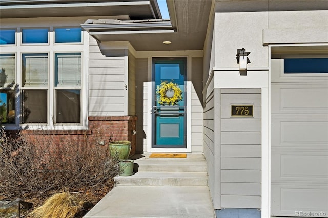 property entrance with a garage