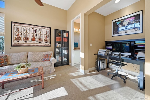 carpeted office space featuring baseboards