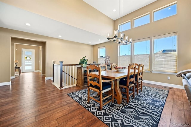 dining space featuring hardwood / wood-style flooring, plenty of natural light, and baseboards