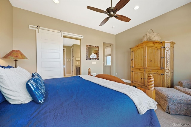 bedroom featuring a barn door, baseboards, a ceiling fan, and recessed lighting