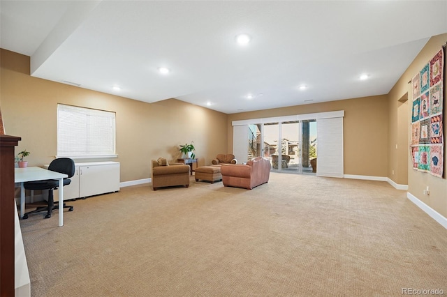 interior space featuring recessed lighting, light carpet, and baseboards