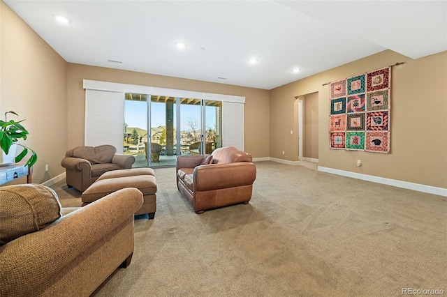 living room featuring recessed lighting, light colored carpet, and baseboards