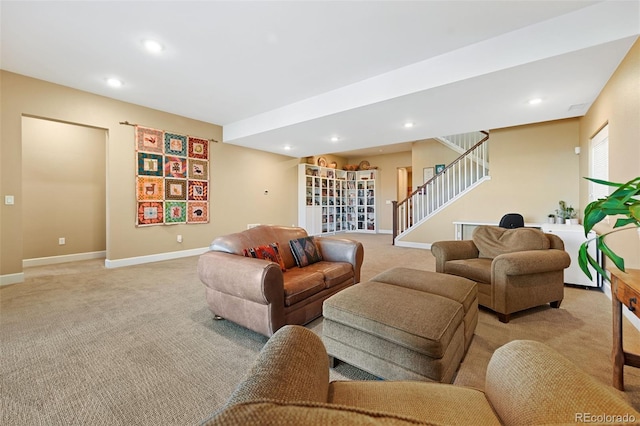 living area featuring stairs, recessed lighting, baseboards, and light colored carpet