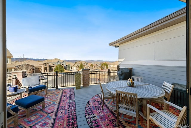 deck featuring a residential view and grilling area