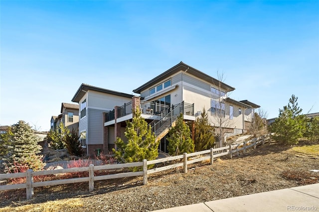 exterior space with stairway and fence