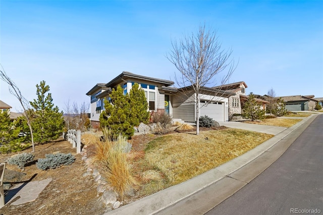 view of front of house featuring a garage and concrete driveway