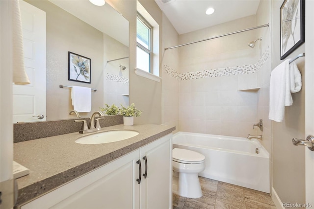 full bath featuring vanity, bathing tub / shower combination, and toilet