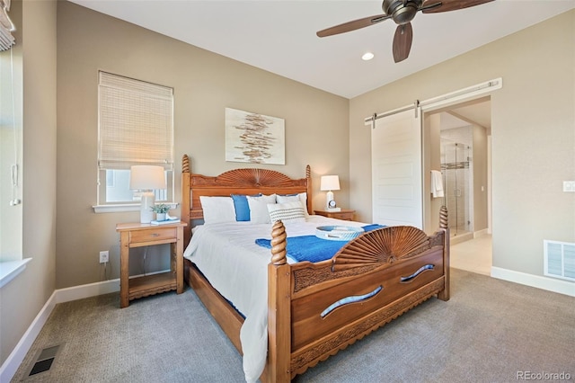 bedroom featuring carpet flooring, recessed lighting, a barn door, and visible vents