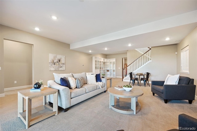 carpeted living room featuring recessed lighting, baseboards, and stairs