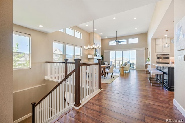 775 Woodgate Dr, Highlands Ranch, CO 80126 - stairway featuring recessed lighting, baseboards, ceiling fan, and hardwood / wood-style flooring