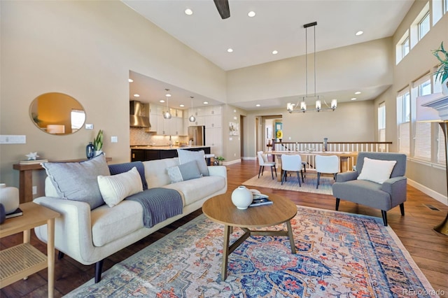 775 Woodgate Dr, Highlands Ranch, CO 80126 - living room featuring baseboards, recessed lighting, a high ceiling, and wood finished floors