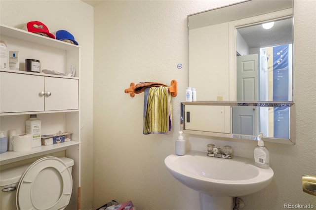 4502 Picturesque, Colorado Springs, CO 80917 - bathroom featuring toilet and sink