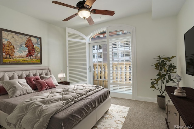 carpeted bedroom with ceiling fan and access to outside