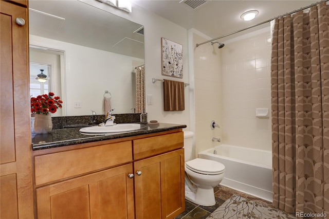 full bathroom featuring vanity, toilet, and shower / bath combo