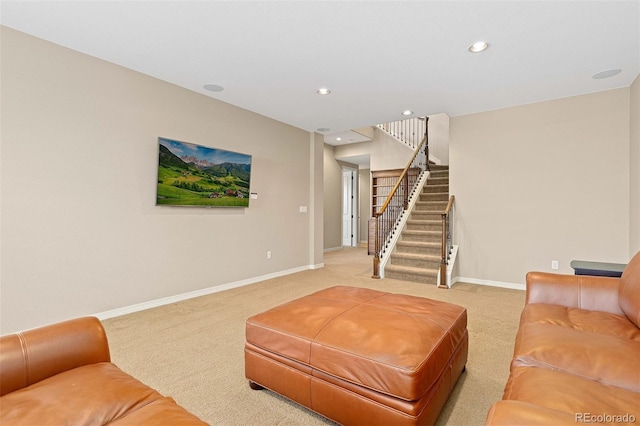 living area with recessed lighting, light carpet, baseboards, and stairs