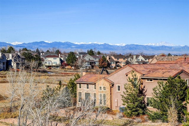 view of mountain backdrop with nearby suburban area