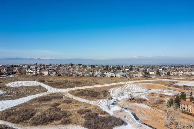 aerial perspective of suburban area featuring a mountainous background