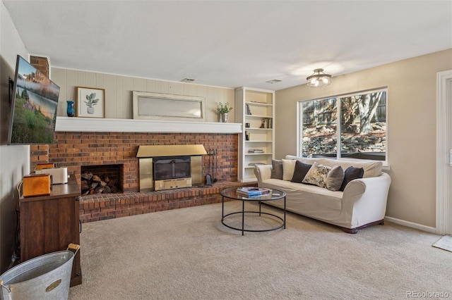living area featuring a fireplace, baseboards, and carpet