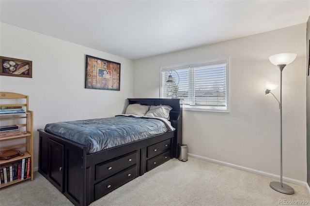 bedroom featuring carpet flooring and baseboards