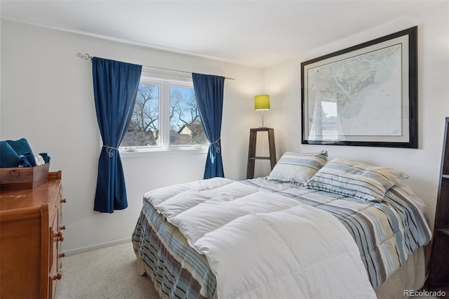 carpeted bedroom featuring baseboards