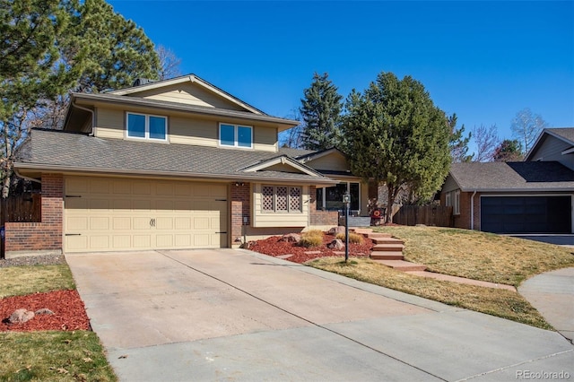 view of front of property with brick siding, driveway, a garage, and fence
