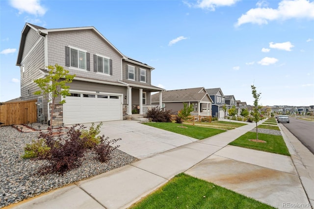 14075 Scarlet Sage St, Parker, CO 80134 - view of front of property featuring an attached garage, driveway, a residential view, and stone siding
