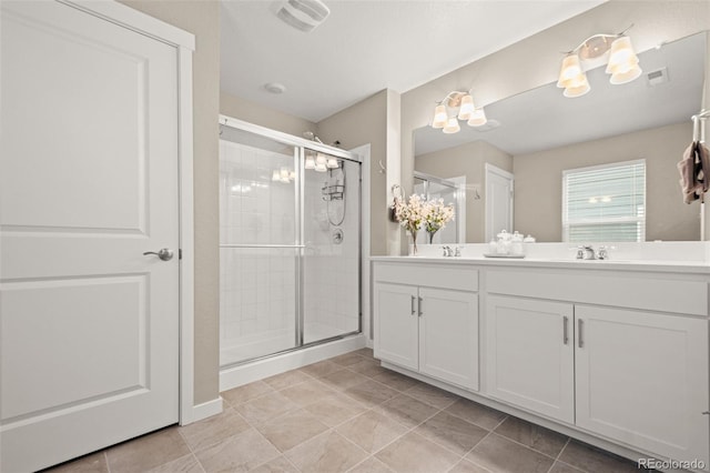 14075 Scarlet Sage St, Parker, CO 80134 - bathroom featuring a stall shower, double vanity, and tile patterned flooring