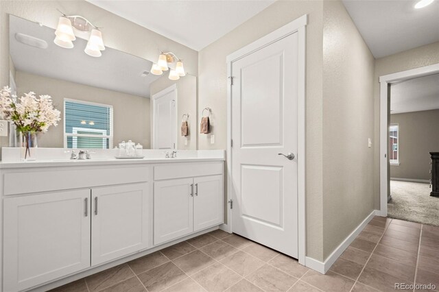 14075 Scarlet Sage St, Parker, CO 80134 - full bathroom featuring healthy amount of natural light, tile patterned floors, and double vanity