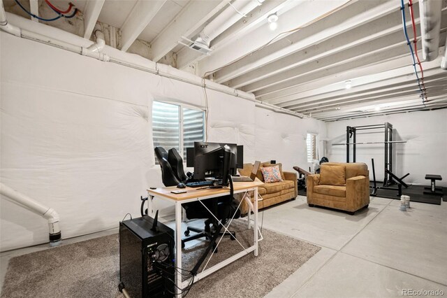 14075 Scarlet Sage St, Parker, CO 80134 - home office featuring concrete floors