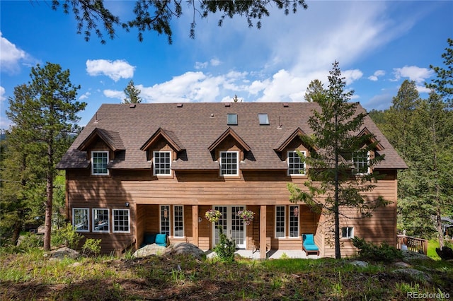 4978 Camel Heights Rd, Evergreen, CO 80439 - view of front of property with a patio and a shingled roof