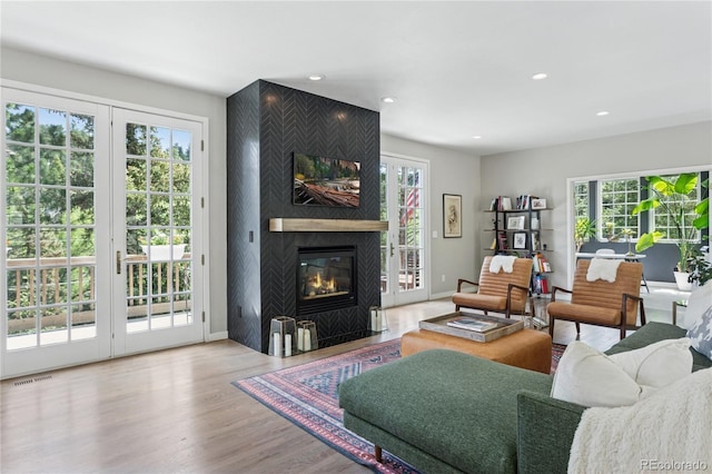 4978 Camel Heights Rd, Evergreen, CO 80439 - living area featuring wood finished floors, a large fireplace, and recessed lighting